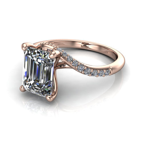 Aurora emerald classic engagement ring in 18K Rose Gold, three-quarter perspective showing the solitaire center diamond above a twisting pav&eacute; bypass shank