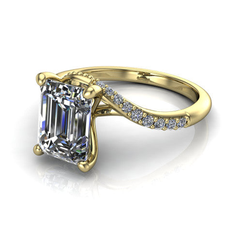 Aurora emerald classic engagement ring in 14K Yellow Gold, three-quarter perspective showing the solitaire center diamond above a twisting pav&eacute; bypass shank