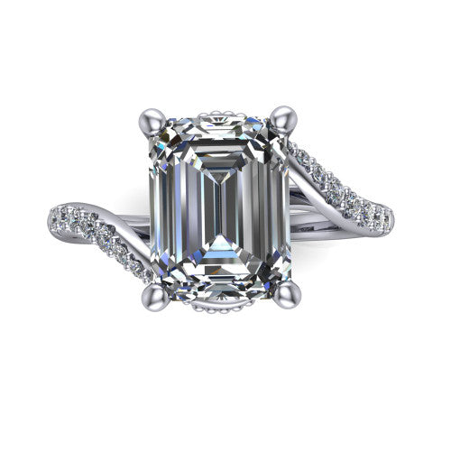 Aurora emerald classic engagement ring in 18K White Gold, top-down view showing the prong-set center diamond where the pav&eacute; bypass shank crosses beneath the head