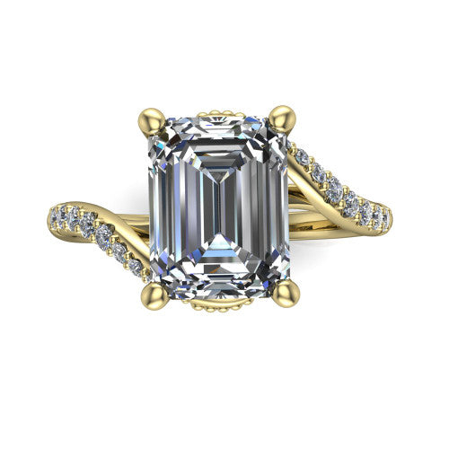 Aurora emerald classic engagement ring in 14K Yellow Gold, top-down view showing the prong-set center diamond where the pav&eacute; bypass shank crosses beneath the head