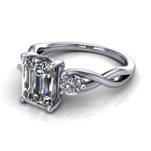 Alina emerald three stone engagement ring in 14K White Gold, three-quarter perspective showing the emerald center between two round side stones above a twisted vine band