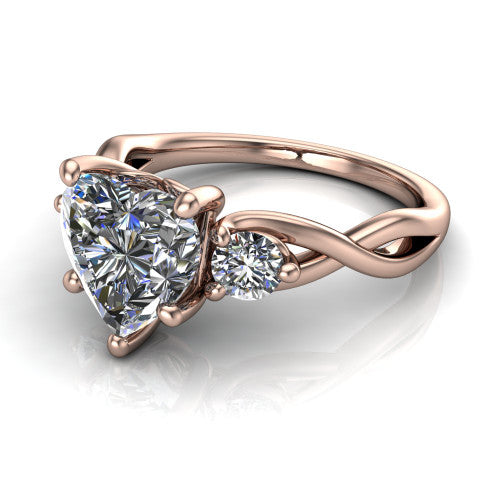 Alina heart three stone engagement ring in 18K Rose Gold, three-quarter perspective showing the heart center between two round side stones above a twisted vine band
