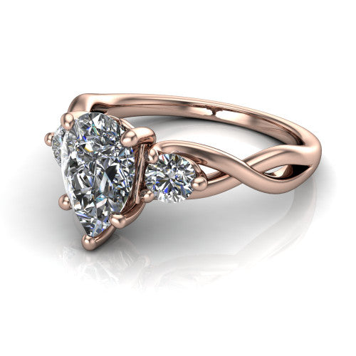 Alina pear three stone engagement ring in 18K Rose Gold, three-quarter perspective showing the pear center between two round side stones above a twisted vine band