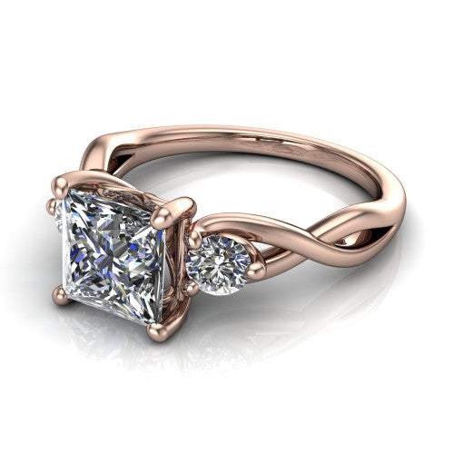 Alina princess three stone engagement ring in 18K Rose Gold, three-quarter perspective showing the princess center between two round side stones above a twisted vine band