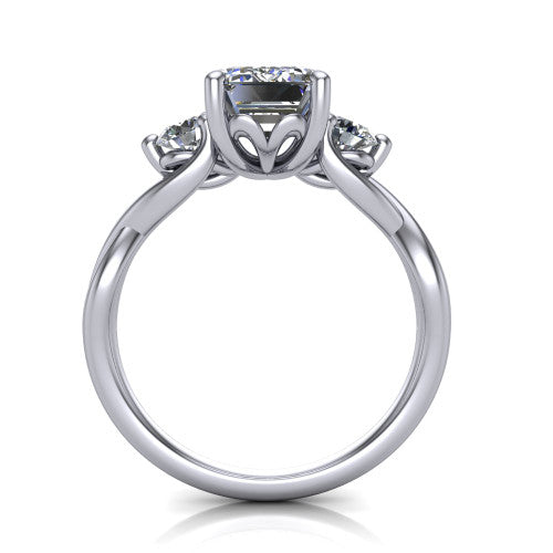 Alina emerald three stone engagement ring in 18K White Gold, through-finger front profile showing the three-stone head and floral basket above the vine band