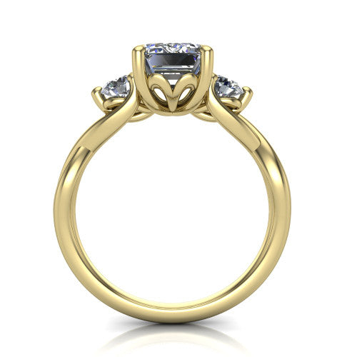 Alina emerald three stone engagement ring in 14K Yellow Gold, through-finger front profile showing the three-stone head and floral basket above the vine band