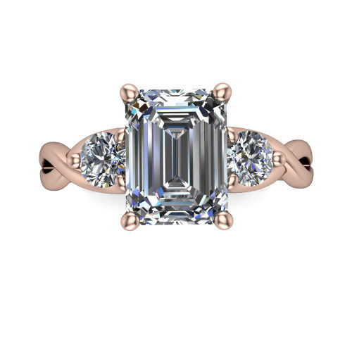 Alina emerald three stone engagement ring in 14K Rose Gold, top-down view showing the emerald center flanked by two round accent diamonds