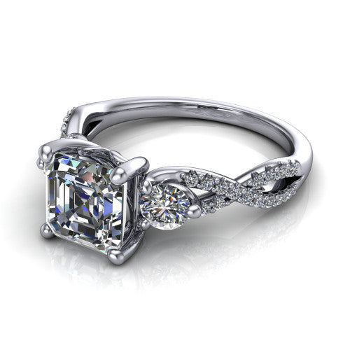 Ryleigh square emerald three stone engagement ring in 14K White Gold, three-quarter perspective showing the square emerald center between two round side stones above a twisted pav&eacute; band