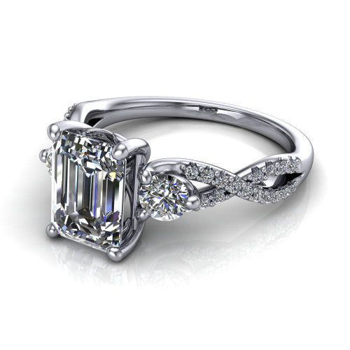Ryleigh emerald three stone engagement ring in 14K White Gold, three-quarter perspective showing the emerald center between two round side stones above a twisted pav&eacute; band