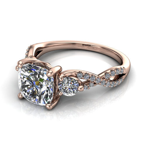 Ryleigh cushion three stone engagement ring in 14K Rose Gold, three-quarter perspective showing the cushion center between two round side stones above a twisted pav&eacute; band