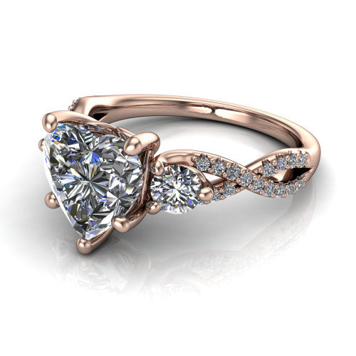 Ryleigh heart three stone engagement ring in 18K Rose Gold, three-quarter perspective showing the heart center between two round side stones above a twisted pav&eacute; band