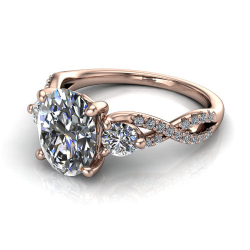 Ryleigh oval three stone engagement ring in 14K Rose Gold, three-quarter perspective showing the oval center between two round side stones above a twisted pav&eacute; band