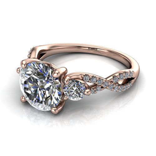 Ryleigh round three stone engagement ring in 14K Rose Gold, three-quarter perspective showing the round center between two round side stones above a twisted pav&eacute; band