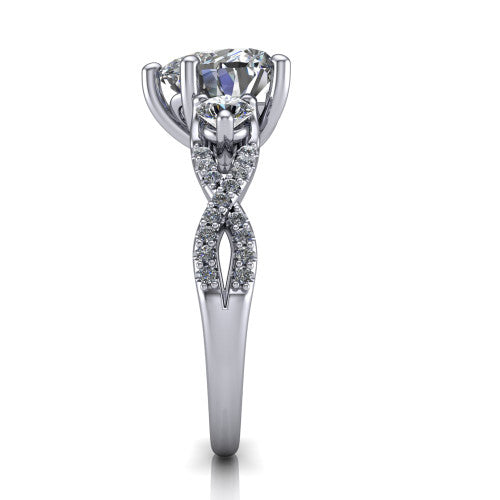 Ryleigh heart three stone engagement ring in Platinum, side profile showing the twisted pav&eacute; infinity band sweeping to the heart center