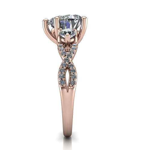 Ryleigh heart three stone engagement ring in 18K Rose Gold, side profile showing the twisted pav&eacute; infinity band sweeping to the heart center