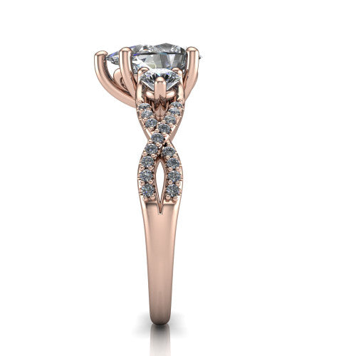 Ryleigh pear three stone engagement ring in 18K Rose Gold, side profile showing the twisted pav&eacute; infinity band sweeping to the pear center
