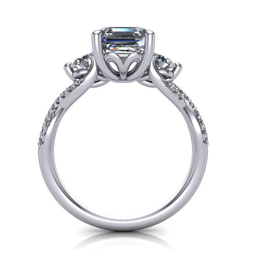 Ryleigh square emerald three stone engagement ring in Platinum, through-finger front profile showing the three-stone head and floral basket above the twisted band