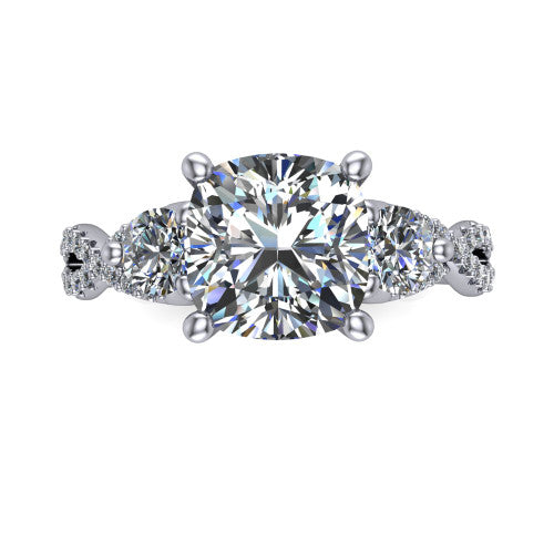 Ryleigh cushion three stone engagement ring in Platinum, top-down view showing the cushion center flanked by two round accent diamonds and the pav&eacute; twist