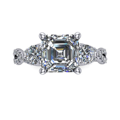 Ryleigh square emerald three stone engagement ring in 18K White Gold, top-down view showing the square emerald center flanked by two round accent diamonds and the pav&eacute; twist