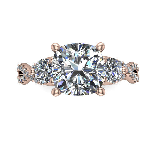 Ryleigh cushion three stone engagement ring in 14K Rose Gold, top-down view showing the cushion center flanked by two round accent diamonds and the pav&eacute; twist