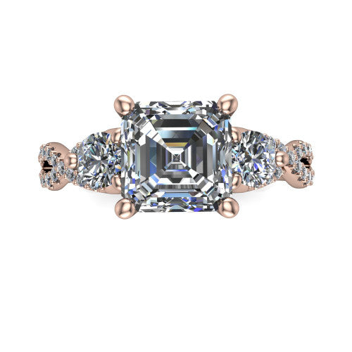 Ryleigh square emerald three stone engagement ring in 14K Rose Gold, top-down view showing the square emerald center flanked by two round accent diamonds and the pav&eacute; twist