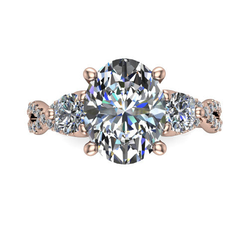 Ryleigh oval three stone engagement ring in 18K Rose Gold, top-down view showing the oval center flanked by two round accent diamonds and the pav&eacute; twist