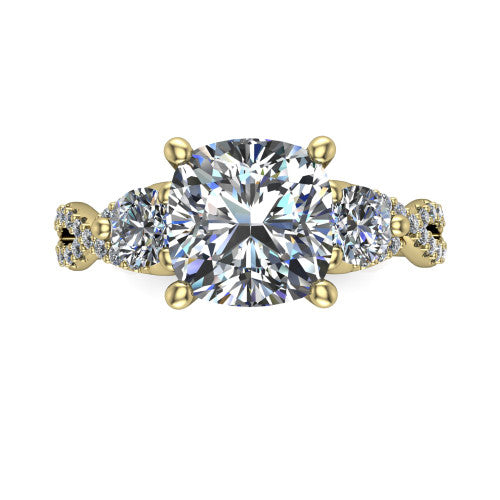 Ryleigh cushion three stone engagement ring in 14K Yellow Gold, top-down view showing the cushion center flanked by two round accent diamonds and the pav&eacute; twist