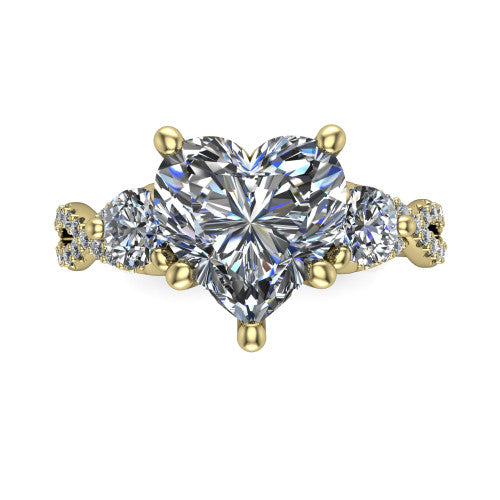Ryleigh heart three stone engagement ring in 18K Yellow Gold, top-down view showing the heart center flanked by two round accent diamonds and the pav&eacute; twist