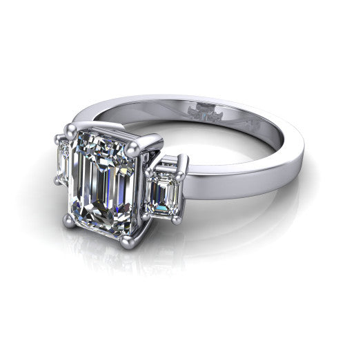 Madelyn emerald three stone engagement ring in 18K White Gold with emerald-cut side stones, three-quarter perspective view