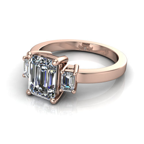 Madelyn emerald three stone engagement ring in 18K Rose Gold with emerald-cut side stones, three-quarter perspective view