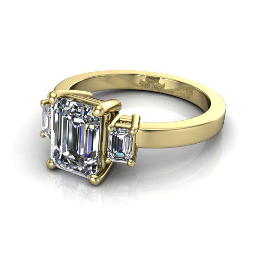 Madelyn emerald three stone engagement ring in 18K Yellow Gold with emerald-cut side stones, three-quarter perspective view