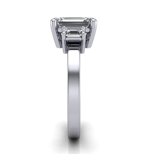 Madelyn emerald three stone engagement ring in 14K White Gold with emerald-cut side stones, side profile showing the plain band and step-cut side stones