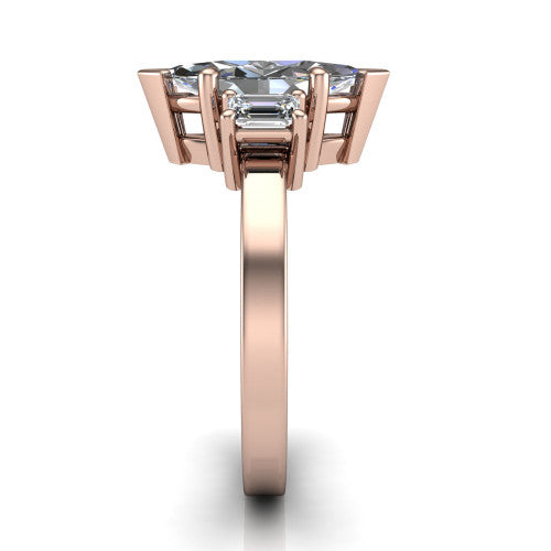Madelyn marquise three stone engagement ring in 14K Rose Gold with emerald-cut side stones, side profile showing the plain band and step-cut side stones
