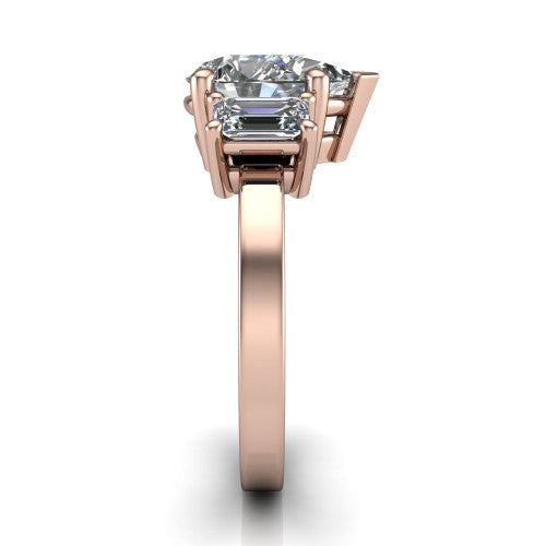 Madelyn pear three stone engagement ring in 14K Rose Gold with emerald-cut side stones, side profile showing the plain band and step-cut side stones