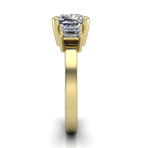 Madelyn cushion three stone engagement ring in 14K Yellow Gold with emerald-cut side stones, side profile showing the plain band and step-cut side stones