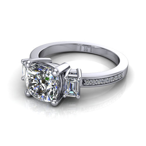 Freya cushion three stone engagement ring in 18K White Gold, three-quarter perspective showing the cushion center between two emerald cut side stones above a pav&eacute; band