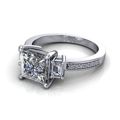 Freya princess three stone engagement ring in Platinum, three-quarter perspective showing the princess center between two emerald cut side stones above a pav&eacute; band