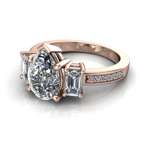 Freya pear three stone engagement ring in 14K Rose Gold, three-quarter perspective showing the pear center between two emerald cut side stones above a pav&eacute; band