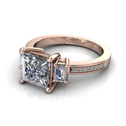 Freya princess three stone engagement ring in 14K Rose Gold, three-quarter perspective showing the princess center between two emerald cut side stones above a pav&eacute; band