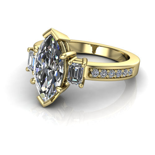 Freya marquise three stone engagement ring in 14K Yellow Gold, three-quarter perspective showing the marquise center between two emerald cut side stones above a pav&eacute; band