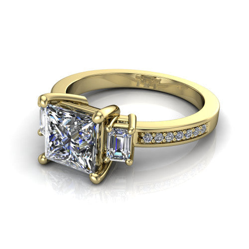Freya princess three stone engagement ring in 14K Yellow Gold, three-quarter perspective showing the princess center between two emerald cut side stones above a pav&eacute; band