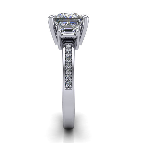 Freya princess three stone engagement ring in Platinum, side profile showing the pav&eacute; milgrain band and the three-stone setting in profile