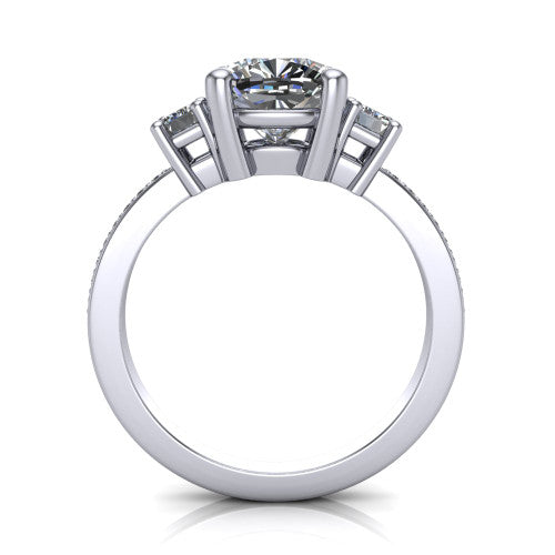 Freya cushion three stone engagement ring in Platinum, through-finger front profile showing the three-stone head above the open under-gallery and pav&eacute; band