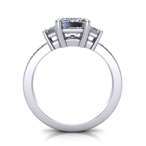 Freya emerald three stone engagement ring in Platinum, through-finger front profile showing the three-stone head above the open under-gallery and pav&eacute; band