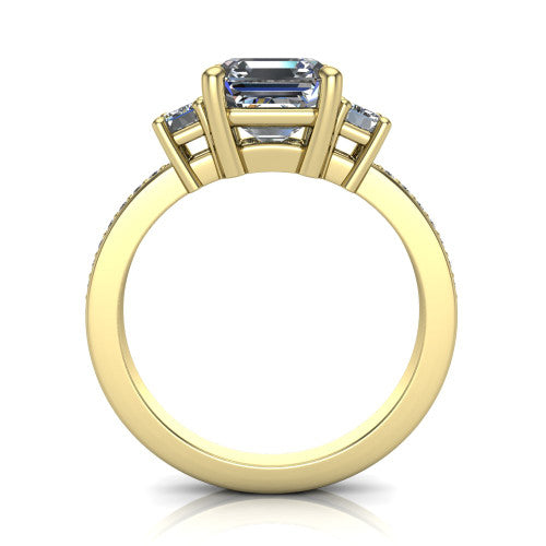 Freya square emerald three stone engagement ring in 18K Yellow Gold, through-finger front profile showing the three-stone head above the open under-gallery and pav&eacute; band