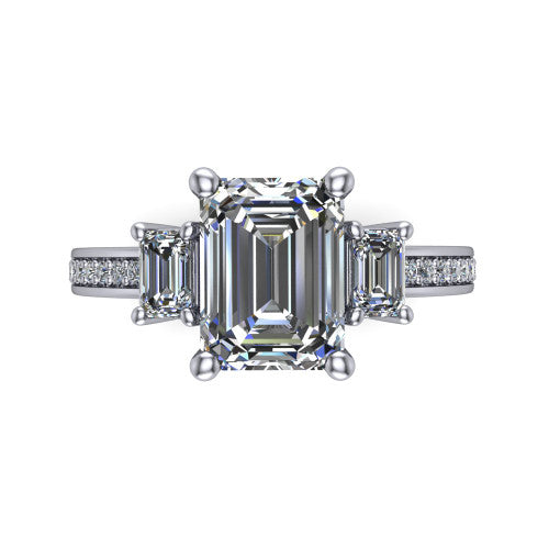 Freya emerald three stone engagement ring in 14K White Gold, top-down view showing the emerald center flanked by two emerald cut step-cut side diamonds