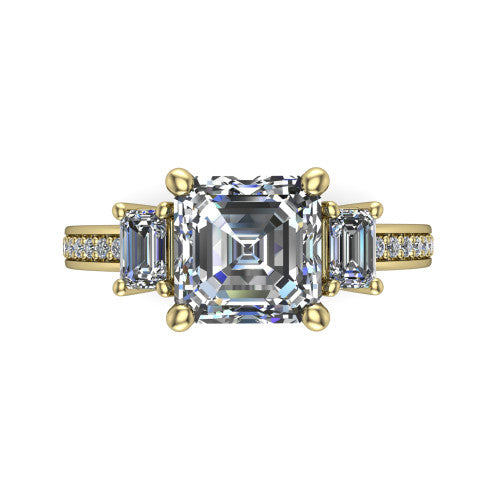 Freya square emerald three stone engagement ring in 18K Yellow Gold, top-down view showing the square emerald center flanked by two emerald cut step-cut side diamonds