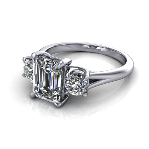 Jasmine emerald three stone engagement ring in Platinum with round side stones, three-quarter perspective view