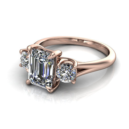 Jasmine emerald three stone engagement ring in 14K Rose Gold with round side stones, three-quarter perspective view