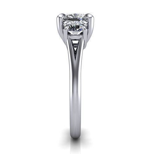 Jasmine cushion three stone engagement ring in Platinum with round side stones, side profile showing the plain band and split under-gallery